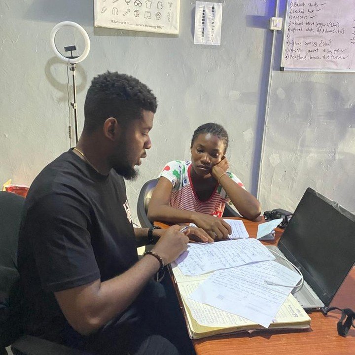 Ejike working through a business task with a team member